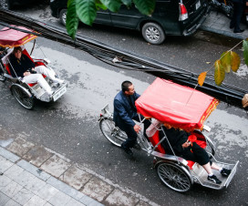 Foreigners on cyclo tours around Hanoi Old Quarter - Things to do in Hanoi