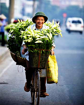 A man selling lily flowers - Hanoi travel guide