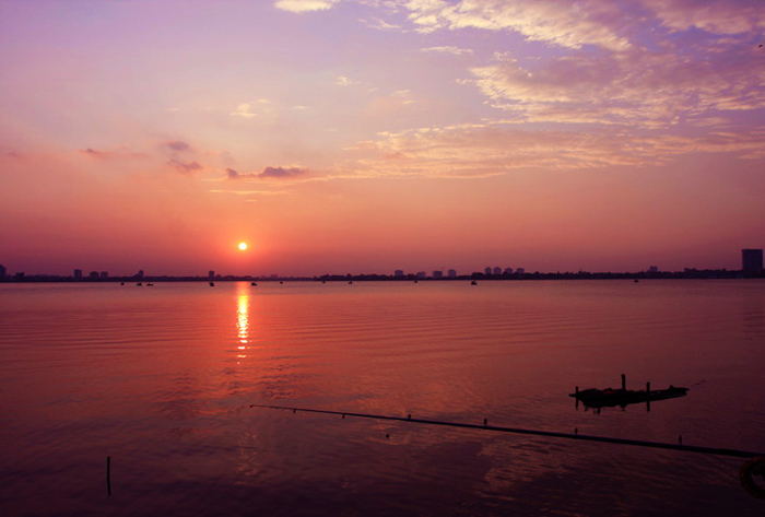 Charming sunset on the West Lake - tours in Hanoi