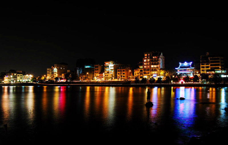 The sparkling West Lake at night - Things to do in Hanoi