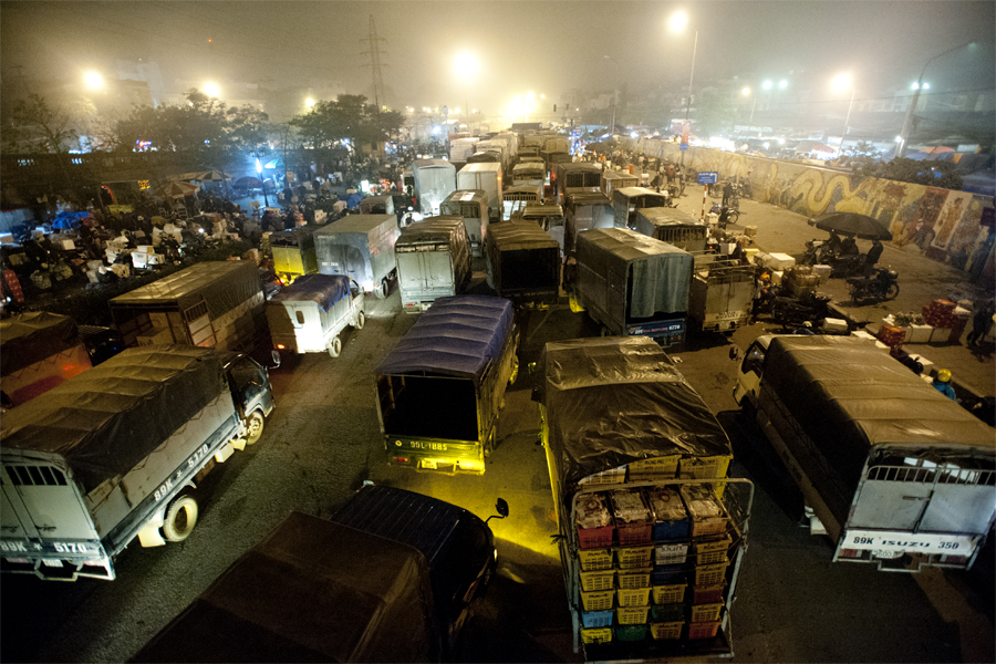 Trucks rolling into Long Bien Night Market - a visit to Hanoi market